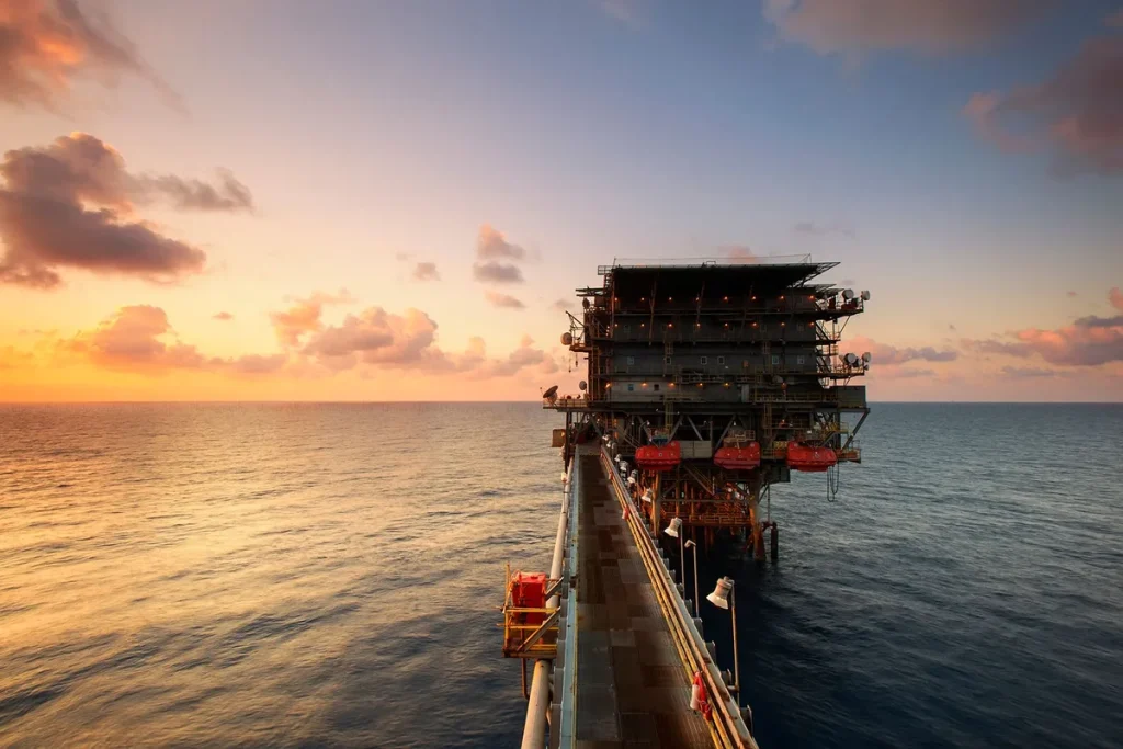 Industrial mining and oil extraction equipment in a landscape with investment infrastructure