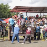 Crowd of farmers and reporters gathered at an agricultural fair in rural Argentina