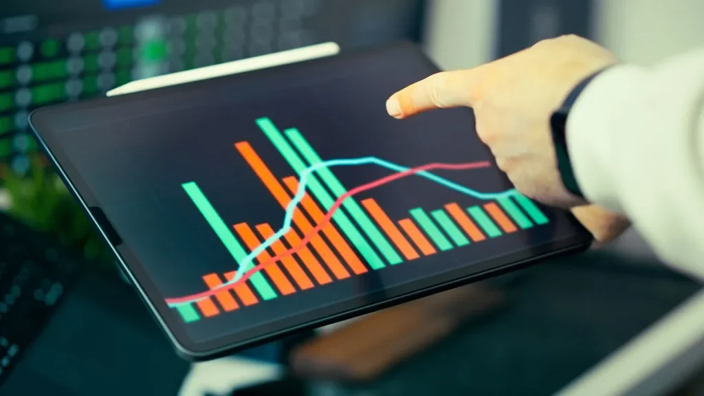 Marketer analyzing brand visibility and AI marketing metrics on computer dashboard
