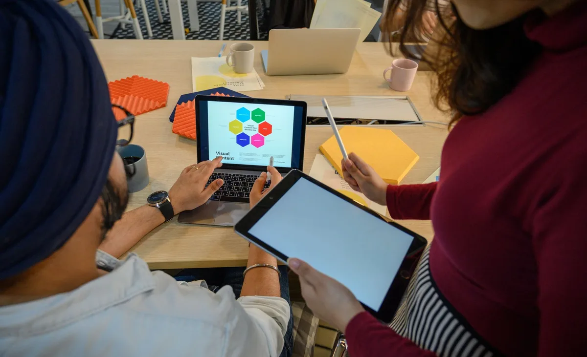 Marketer working with integrated marketing dashboard and CRM tools on computer screen