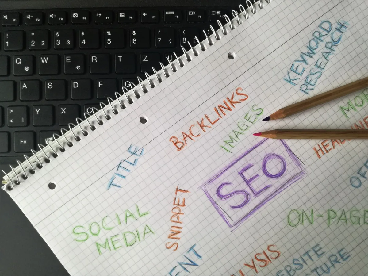 Person optimizing website content with structured data markup on screen