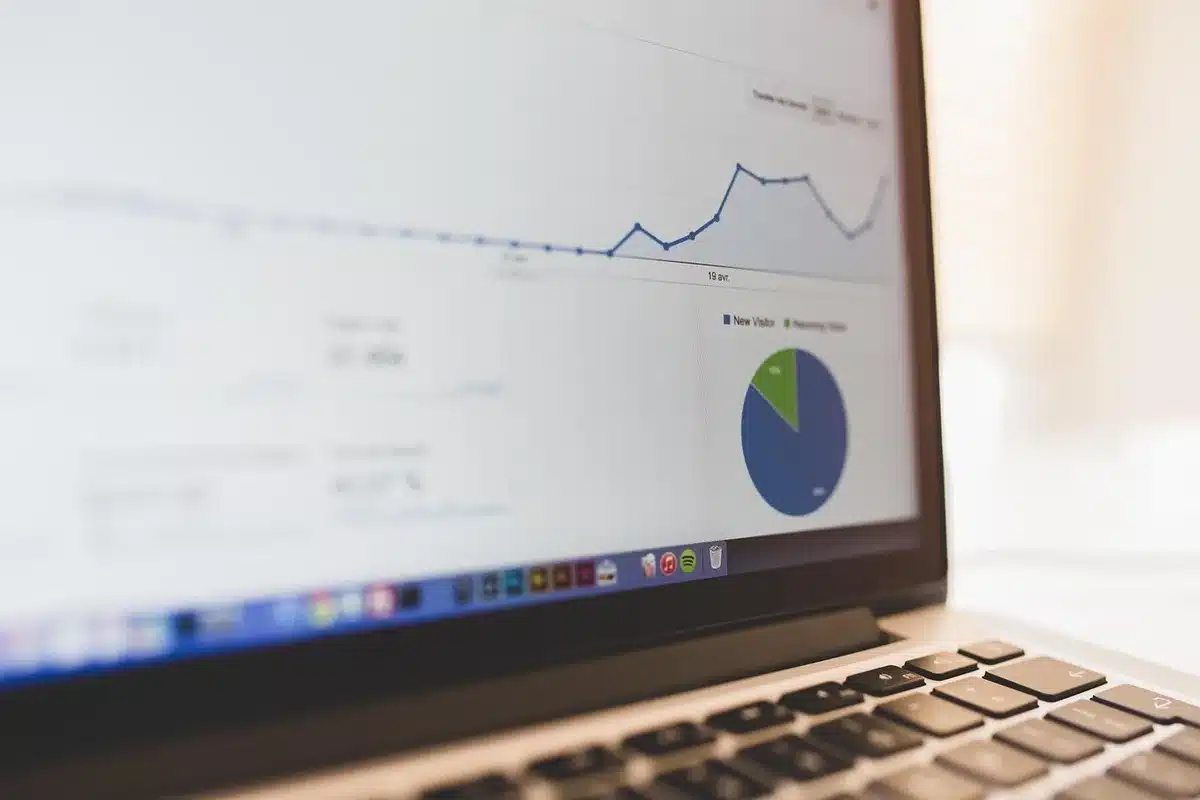 Marketer reviewing analytics dashboard showing brand visibility metrics