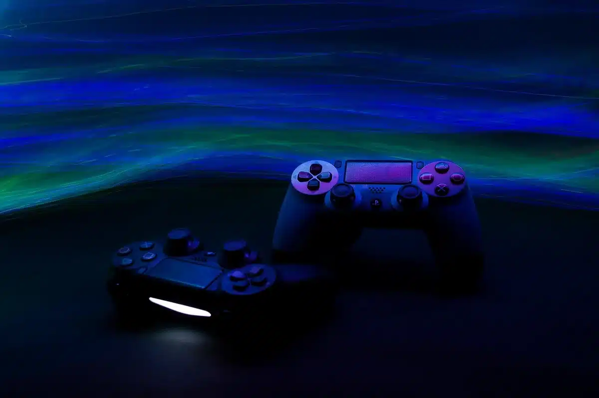 Gaming console and controller displayed prominently, representing blockbuster video game sales and entertainment industr