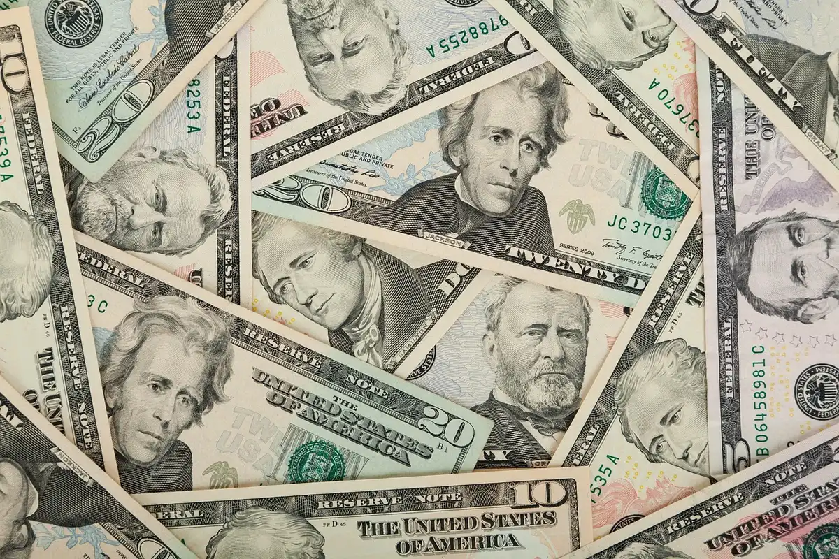 Brazilian real banknotes beside a US dollar to illustrate currency moves