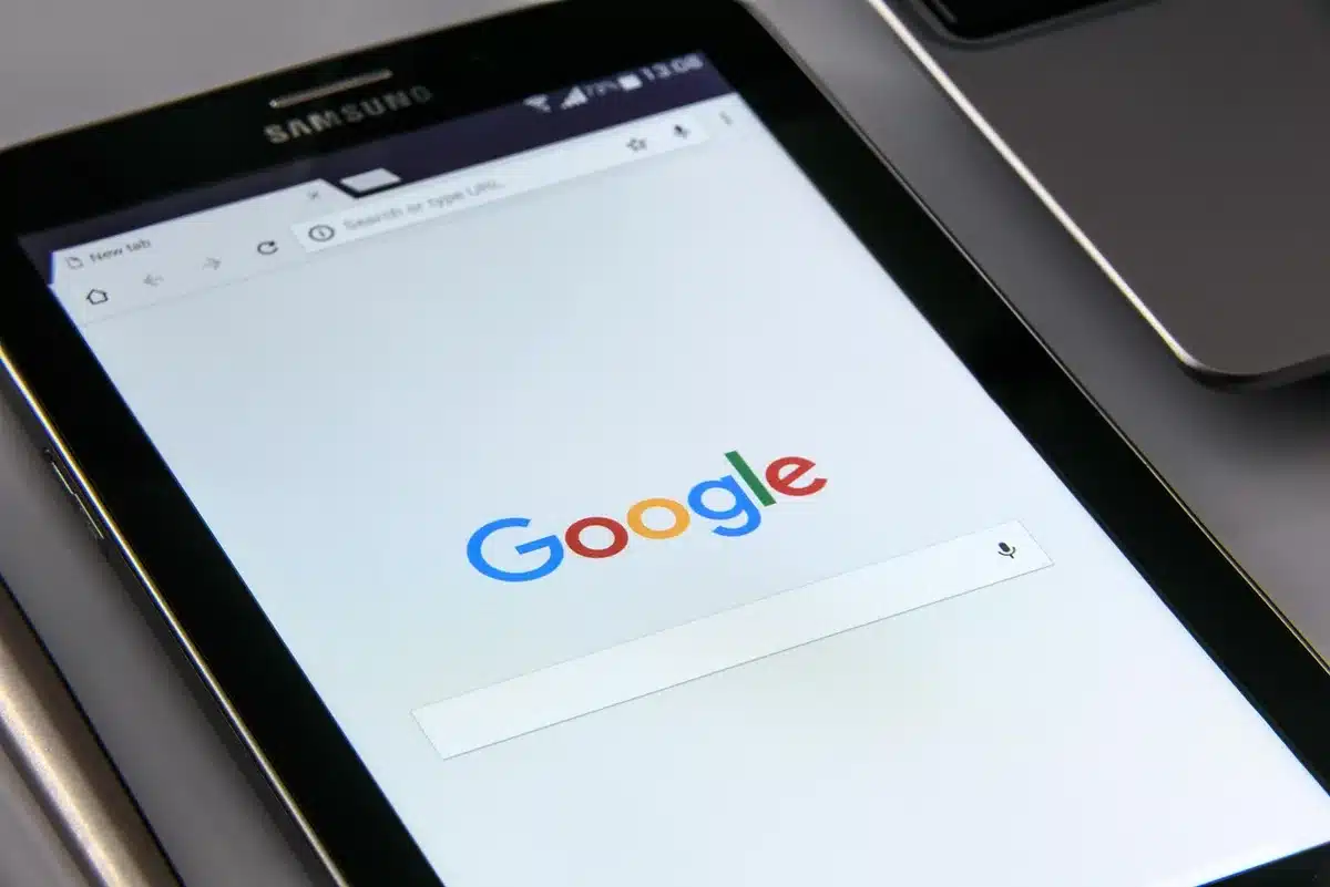 Person considering search queries and chatbot responses on screen