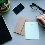 Hands arranging folders labeled Connector, Skill and Plugin on a desk