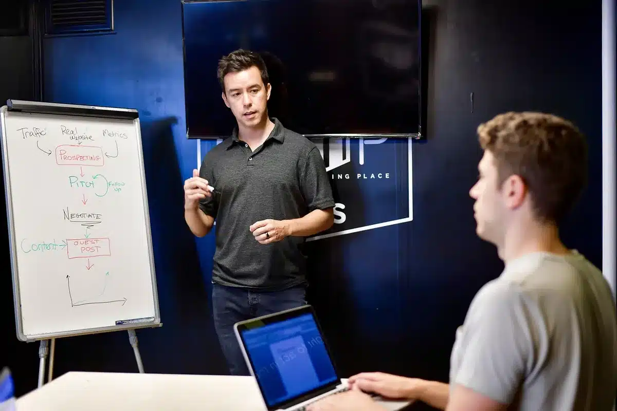 Team planning a 30-day rollout on a whiteboard with calendar and tasks