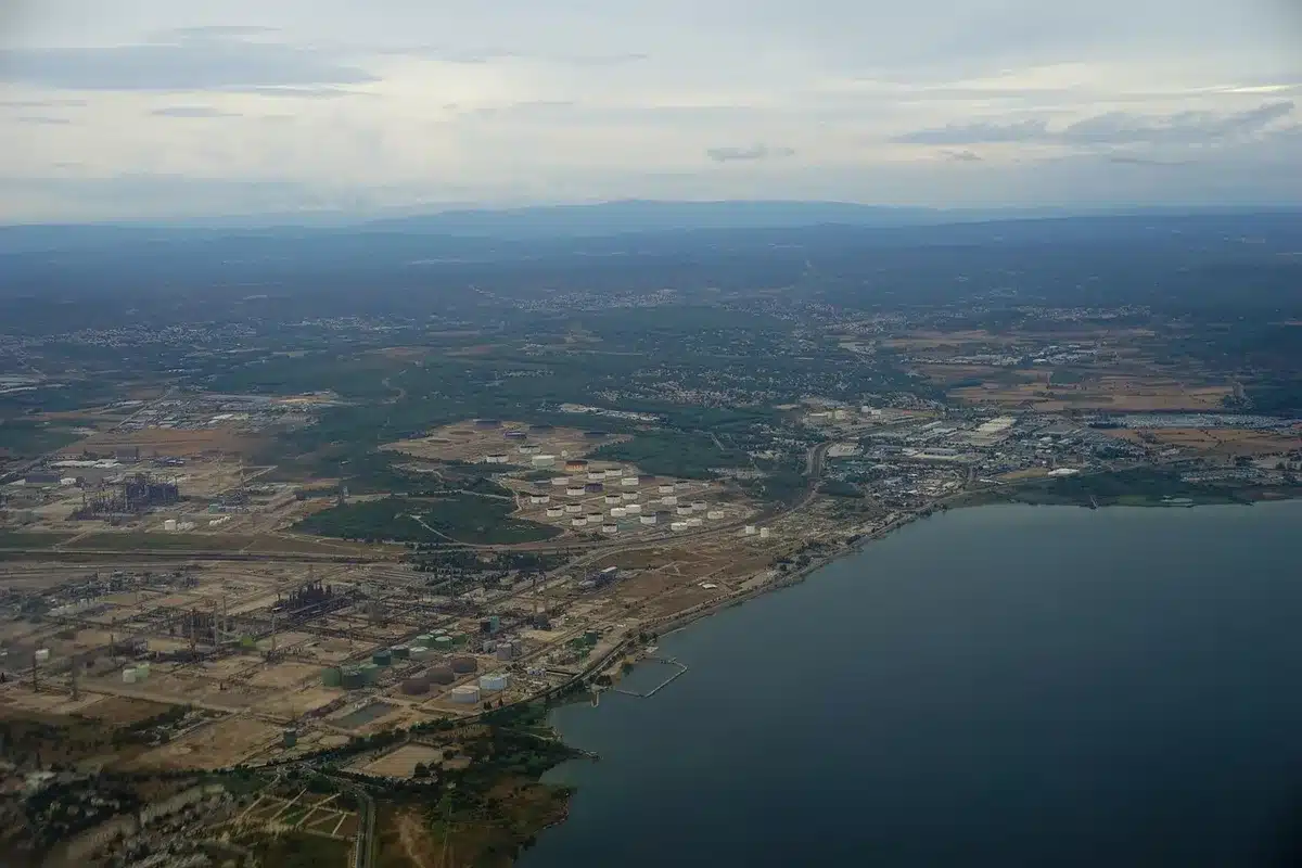 Large diesel storage tanks and pipelines at a port terminal